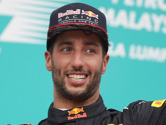 KUALA LUMPUR, MALAYSIA - OCTOBER 01:  Third place finisher Daniel Ricciardo of Australia and Red Bull Racing celebrates on the podium during the Malaysia Formula One Grand Prix at Sepang Circuit on October 1, 2017 in Kuala Lumpur, Malaysia.  (Photo by Clive Mason/Getty Images)