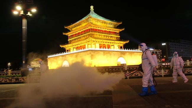 The Bell Tower is disinfected in Xian in China’s Shaanxi Province. Picture: Getty Images