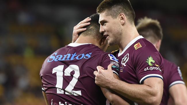 BRISBANE, AUSTRALIA - MARCH 20: Hunter Paisami of the Reds is congratulated by team mate James O'Connor after scoring a try during the round five Super RugbyAU match between the Queensland Reds and the Western Force at Suncorp Stadium, on March 20, 2021, in Brisbane, Australia. (Photo by Albert Perez/Getty Images)