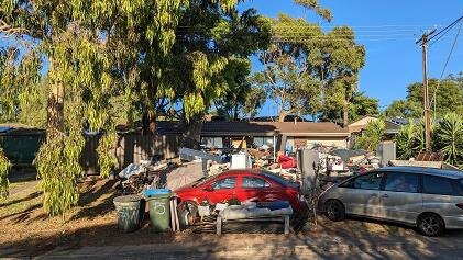 Hoarding in front of an Onkaparinga Council house. Picture: Supplied