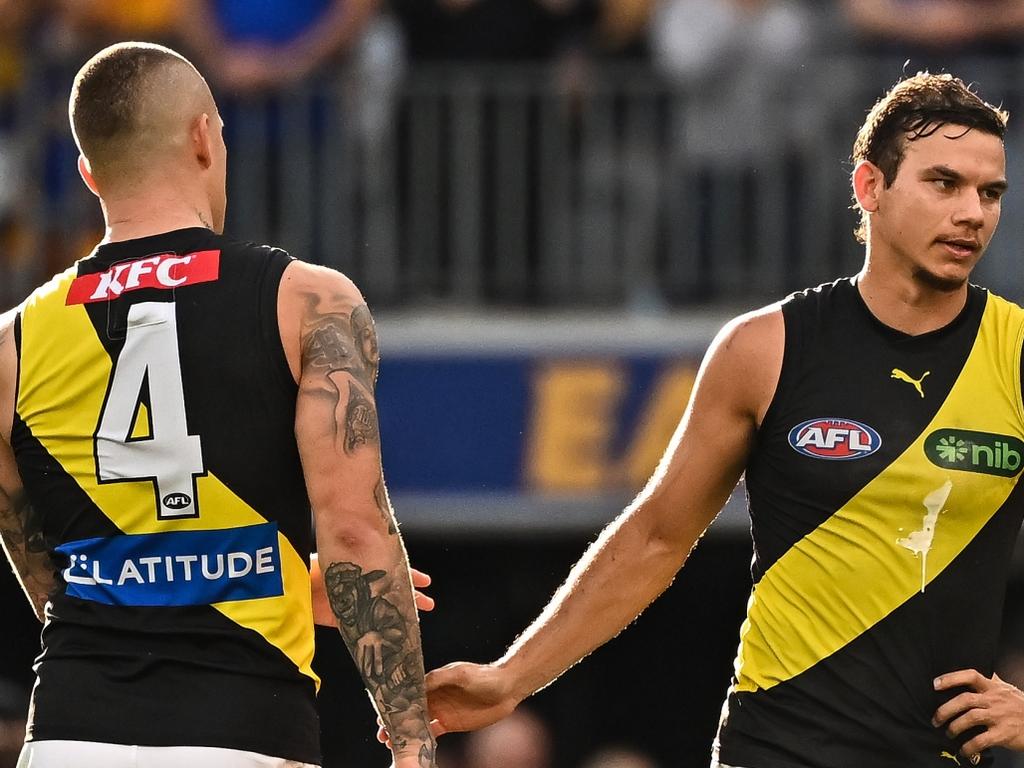 PERTH, AUSTRALIA - APRIL 14: Dustin Martin and Daniel Rioli of the Tigers are upset after the loss during the 2024 AFL Round 05 match between the West Coast Eagles and the Richmond Tigers at Optus Stadium on April 14, 2024 in Perth, Australia. (Photo by Daniel Carson/AFL Photos via Getty Images)