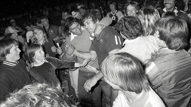 Queensland captain Artie Beetson is swamped by well-wishers after the first State of Origin match.