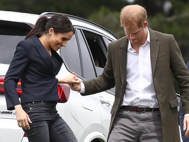 Another PDA from the royal couple, this time at the unveiling of the Queen's Commonwealth Canopy in Redvale. Picture: Getty Images