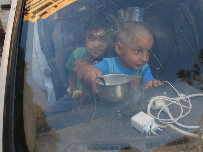 Lebanese children, that fled with their family from their village in southern Lebanon, sit inside a truck upon their arrival to seek refuge at a public school in the Sidon. Picture: AFP