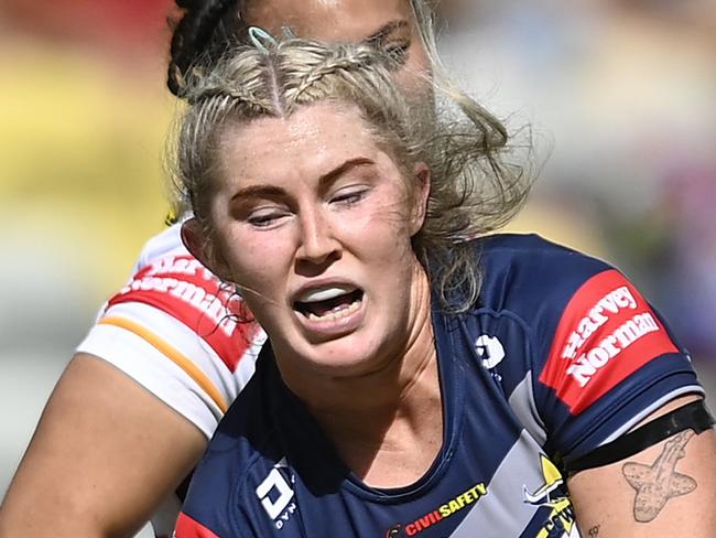 TOWNSVILLE, AUSTRALIA - AUGUST 05: Makenzie Weale of the Cowboys is tackled during the round three NRLW match between North Queensland Cowboys and Brisbane Broncos at Queensland Country Bank Stadium, on August 05, 2023, in Townsville, Australia. (Photo by Ian Hitchcock/Getty Images)