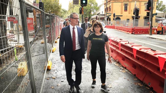 Opposition Leader Michael Daley talks to Hiscoes Gym owner Susan Kingsmill among the chaos of the light rail. Picture: Mark Evans/Getty Images