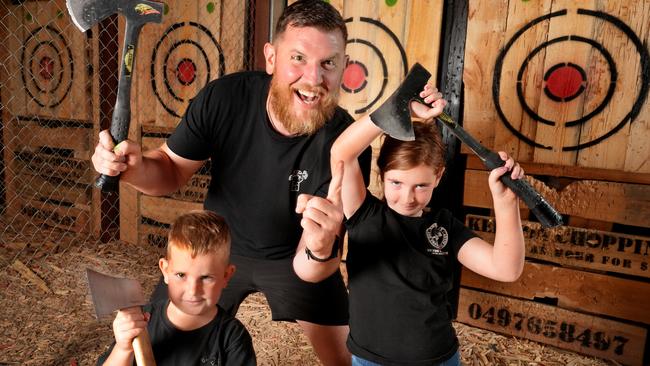 Baz Dewson of CHOP IT Axe Throwing &amp; Escape IT Rooms at Victor Harbor, with kids Sol and Grace. Picture: Dean Martin