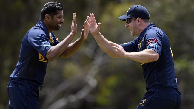 Chanaka Welegedara and Johnny Bassi celebrate a wicket. Picture: Andy Brownbill