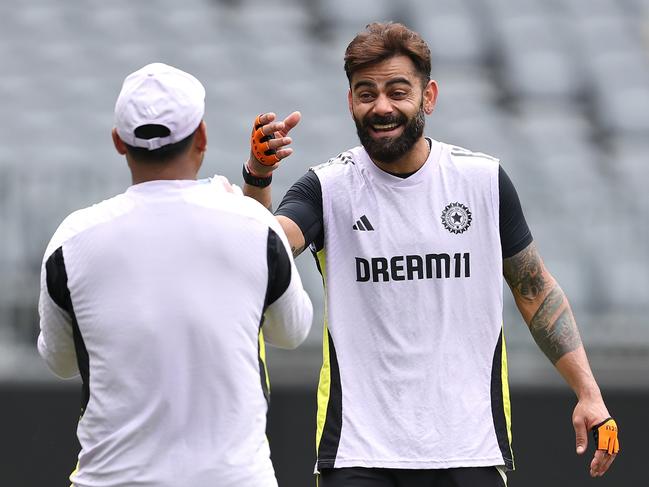 PERTH, AUSTRALIA - NOVEMBER 19: Virat Kohli and Rishabh Pant share a moment during an India Test Squad training session at Optus Stadium on November 19, 2024 in Perth, Australia. (Photo by Paul Kane/Getty Images)