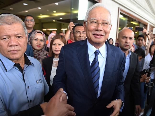 Former Malaysia's prime minister Najib Razak leaves the courthouse in Kuala Lumpur on December 12, 2018 after being charged in court. - Malaysian ex-leader Najib Razak and Arul Kanda, the former 1MDB head were charged on December 12 with altering an audit of the state fund at the centre of a scandal which helped topple the last government. (Photo by MOHD RASFAN / AFP)