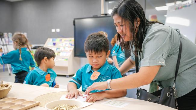 Joy Cantoria and her son Kyle on the first day of school at Zuccoli Primary. Picture: GLENN CAMPBELL