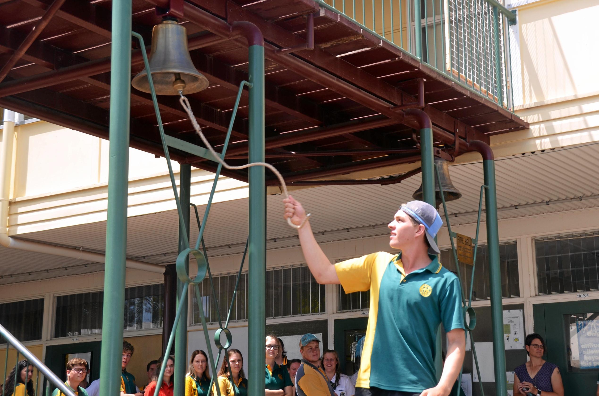 Burnett State College Year 12 students, class of 2018, ring their school bell to symbolise the end of their schooling. Picture: Felicity Ripper