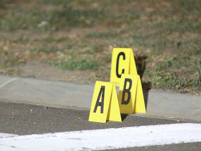 Evidence markers on the road and gutter. Photo: Patrick Herve.