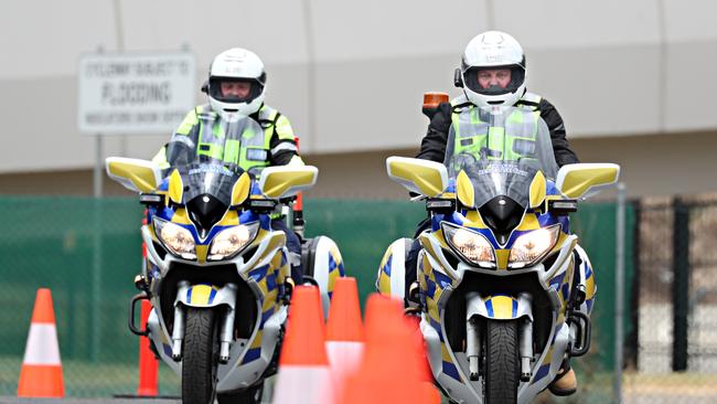 Darren Nolan and Paul Hillman test the new bikes that will be used in the trial on the Logan and Gateway motorways. Picture: Annette Dew