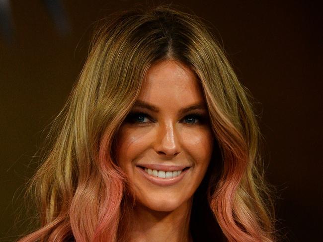 Former Miss Universe and model Jennifer Hawkins displays the latest swimwear during a rehearsal for the 2015 Myer Spring-Summer Fashion launch in Sydney on August 7, 2014. AFP PHOTO / Saeed KHAN