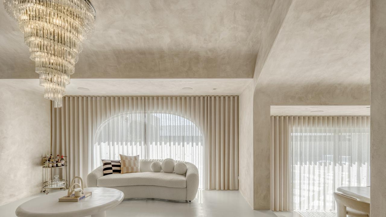 Floor-to-ceiling render lends a smooth, marble-like finish