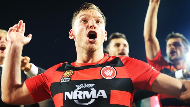 Brendon Santalab leads the team song after the Wanderers derby win. Picture: Mark Evans
