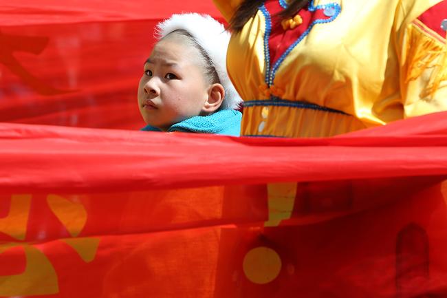 A young member of the Holy Tantra Esoteric Buddism float