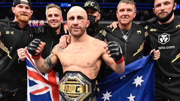 UFC champ Alex Volkanovski celebrates after defending featherweight title against Brian Ortega at UFC 266.