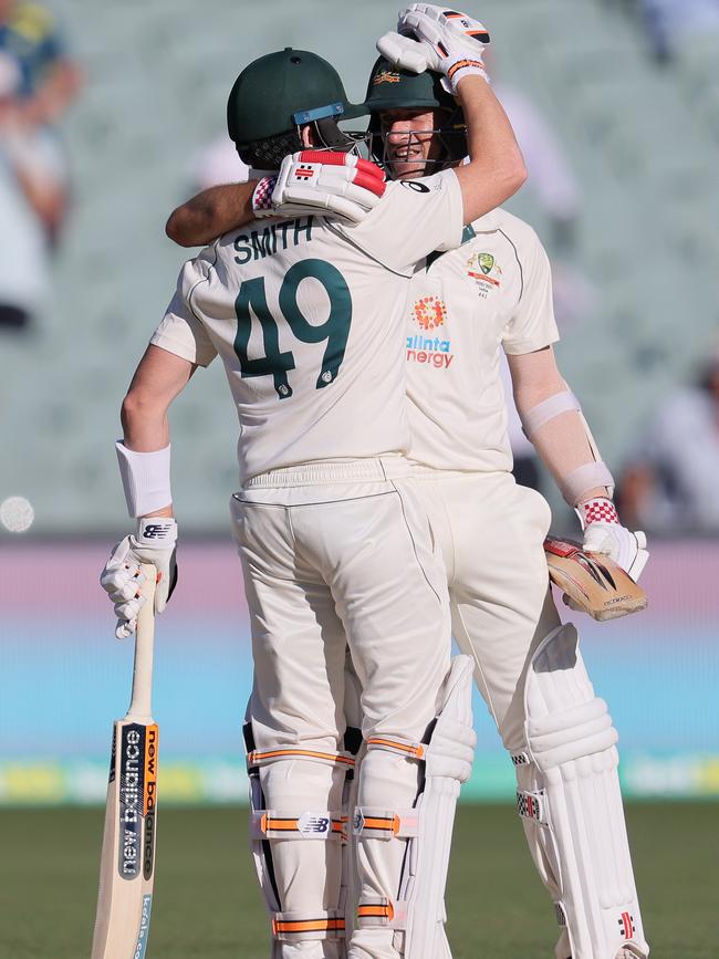 Joe Burns is congratulated by Steve Smith after hitting a six to make his 50 and win the match. Picture: Getty Images