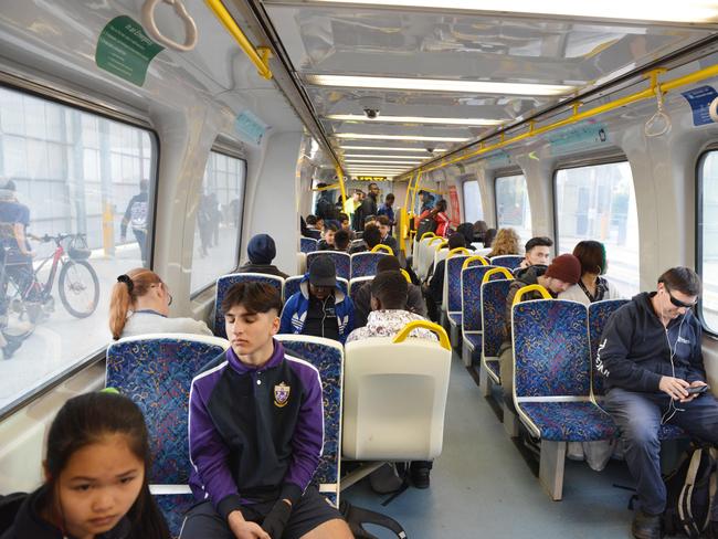 Passengers on-board a train at Mawson Lakes train station. Picture: Brenton Edwards