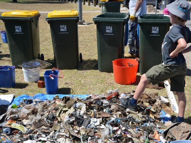 Volunteers with buckets of plastic and waste collected from the Adelaide Dolphin Sanctuary in November and December 2018. Pictures: Supplied