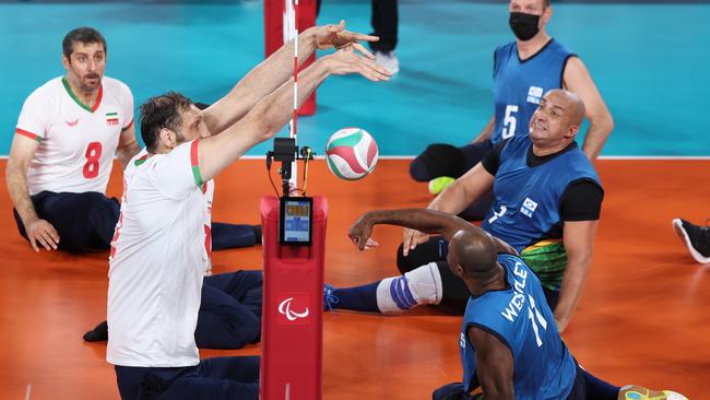 Morteza Mehrzad blocks Wescley Conceicao de Oliveira during Iran’s pool game against Brazil. (Photo by Kiyoshi Ota/Getty Images)