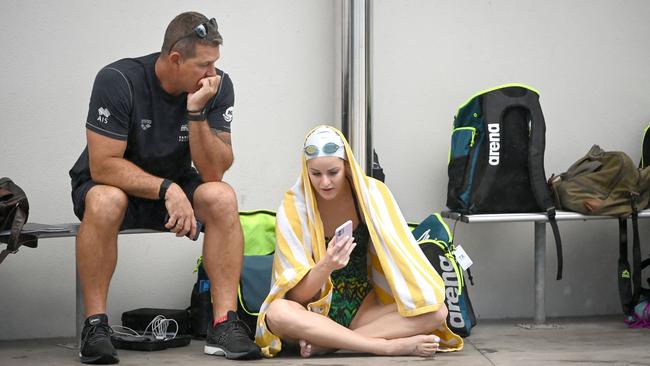 Coach Chris Mooney sits with McKeown during a training session in Cairns in July. Picture: Delly Carr