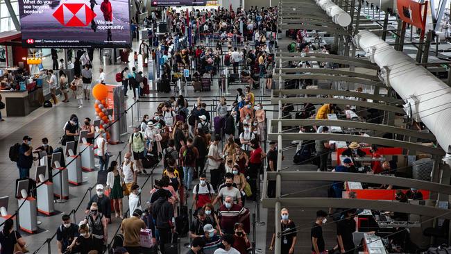 Members of the public are seen at the Sydney Domestic Airport in Sydney as Covid-19 forced two of Australia's major airlines to cancel dozens of flights, throwing Christmas plans into disarray. Picture: NCA NewsWire / Flavio Brancaleone