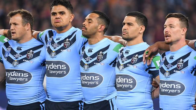 LtoR; Blues players Josh Morris, Latrell Mitchell, Josh Addo-Carr, Cody Walker and Damien Cook are seen during the Australian National Anthem prior to Game 1 of the 2019 State of Origin series between the NSW Blues and the Queensland Maroons at Suncorp Stadium in Brisbane, Wednesday, June 5, 2019. (AAP Image/Dave Hunt) NO ARCHIVING, EDITORIAL USE ONLY