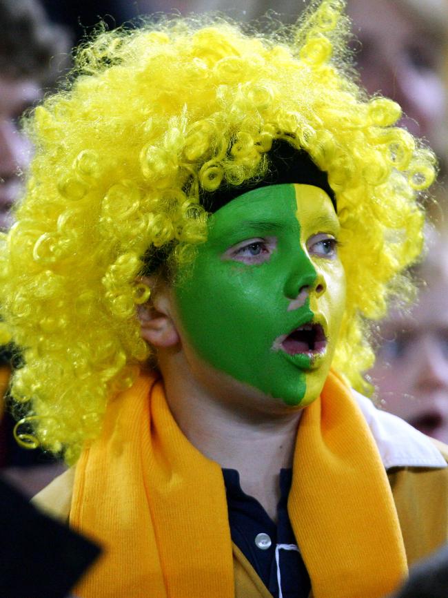 Sing it loud, sing it proud: A rugby fan sings the anthem at ANZ Stadium