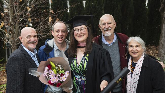 Master of Professional Studies (Research) graduate Gabriella Hartig-Franc is congratulated by (from left) Paul Olive, Paul Askew, Paul Franc and Jana Hartig at a UniSQ graduation ceremony at The Empire, Tuesday, June 25, 2024. Picture: Kevin Farmer