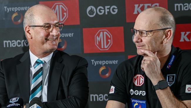 ADELAIDE, AUSTRALIA - FEBRUARY 12:Josh Carr senior assistant coach of Port Adelaide  ,Port Adelaide Football Club chairman David Koch and Ken Hinkley senior coach of Port Adelaide  speak to the media during a Port Adelaide Power AFL press conference at Alberton Oval on February 12, 2025 in Adelaide, Australia. (Photo by Mark Brake/Getty Images)