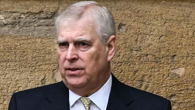 (FILES) Britain's Prince Andrew, Duke of York reacts as he arrives at St. George's Chapel, Windsor Castle, to attend the Easter Mattins Service, on March 31, 2024. A former UK security minister said Friday, december 13, that it was "extremely embarrassing" that a suspected Chinese spy had become a confidant of disgraced royal Prince Andrew. (Photo by JUSTIN TALLIS / AFP)