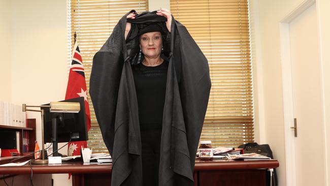 One Nations Leader Senator Pauline Hanson in a black burqa in her office. (Pic: Gary Ramage)