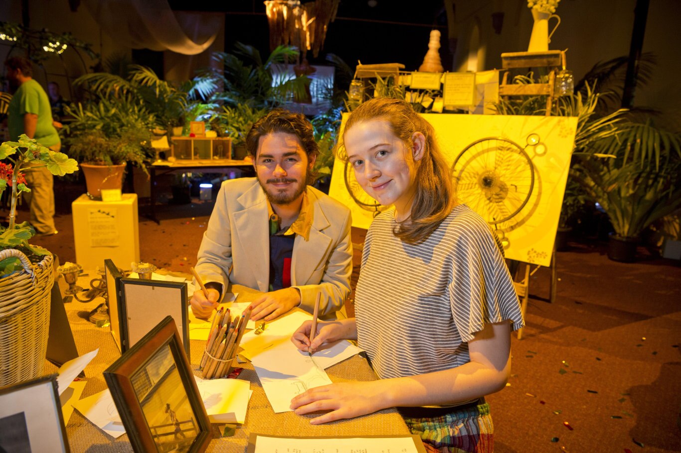 Will Johnston and Jiordan Lobwein leave their mark on a drawing station in the Garden of Curiosity of the Curious Arts Festival, Saturday, March 16, 2019. Picture: Kevin Farmer