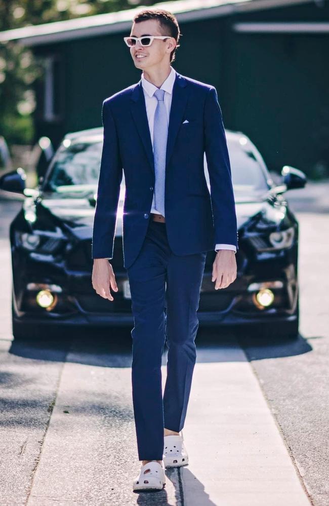 Brody Smith, ahead of his high school formal in 2022, wearing the white crocs and white sunglasses which have become part of the healing process across Hervey Bay following his tragic death in September 2022.