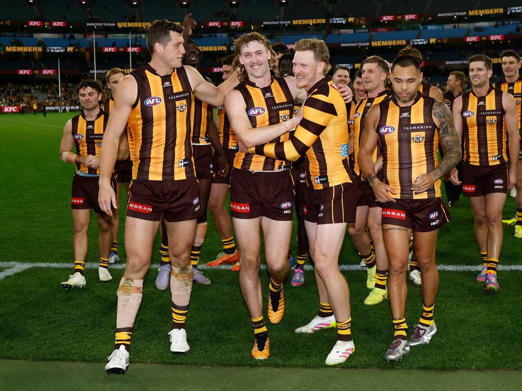 Lloyd Meek, Josh Weddle and James Sicily walk off the MCG. Picture: Michael Willson/AFL Photos via Getty Images.
