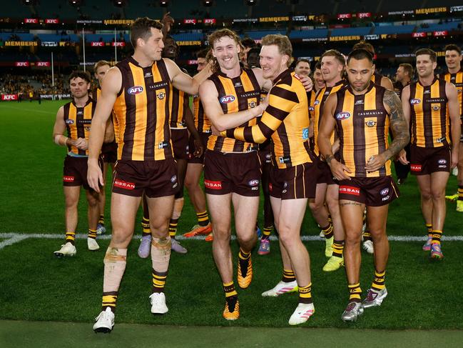 Lloyd Meek, Josh Weddle and James Sicily walk off the MCG. Picture: Michael Willson/AFL Photos via Getty Images.