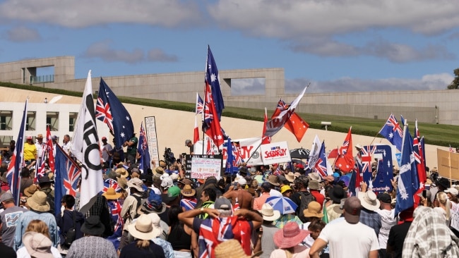 Flags and placards with varying statements could be seen being waved amongst the crowd. Picture: Brook Mitchell/Getty Images