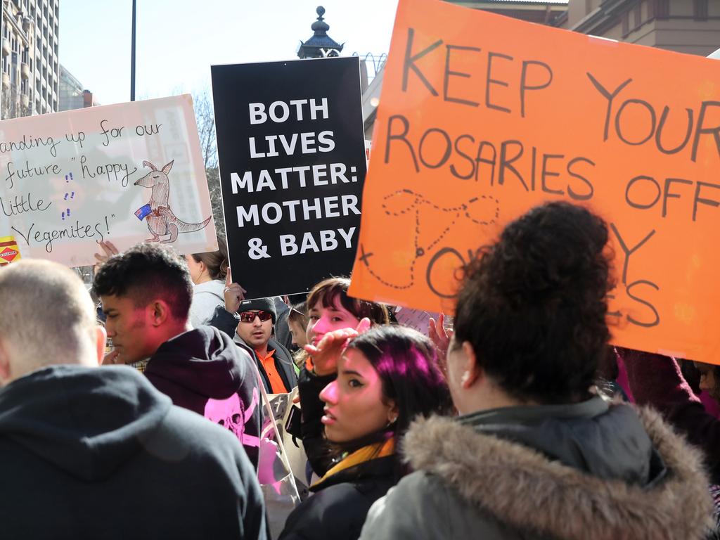 Pro life and pro choice protestors gathered at the front of NSW State Parliament in Sydney ahead of the debate of a possible abortion bill. Picture: Richard Dobson