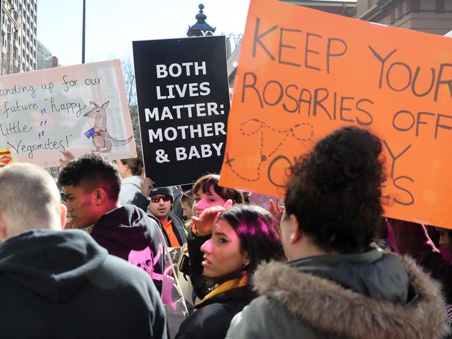 Pro life and pro choice protestors gathered at the front of NSW State Parliament in Sydney ahead of the debate of a possible abortion bill. Picture: Richard Dobson