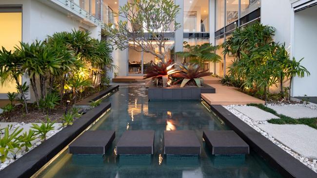 Peace and tranquillity around an indoor water feature inside a Sanctuary Cove home. Picture: Ray White