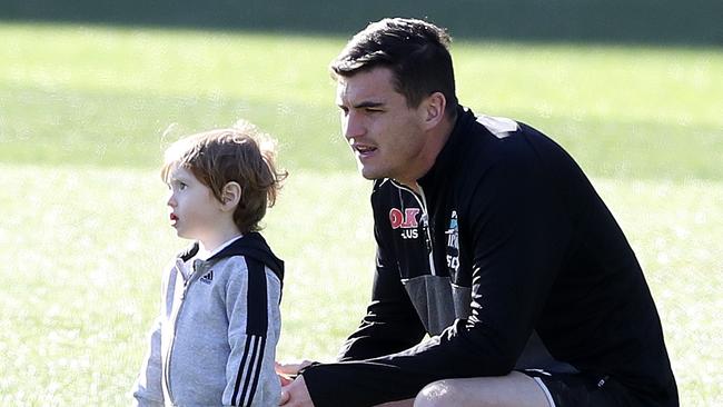 Tom Rockliff with son Jack at Port Adelaide training. Picture: Sarah Reed.