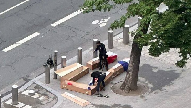 The men arrested over the coffins draped in French flags found near the Eiffel Tower claimed they had been paid €400 (about $750) each by an anonymous person. Picture: The Times