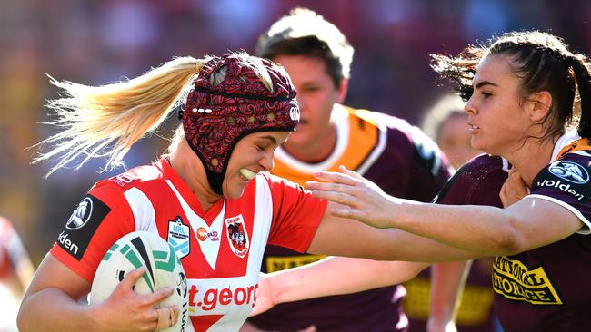 Hannah Southwell (left) fends off Broncos defenders. Picture: AAP