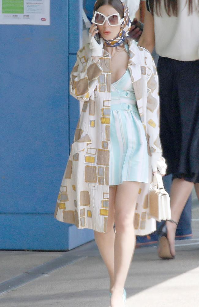 Lily Collins rocks a plunging blue dress while filming series 2 of Emily In  Paris in France