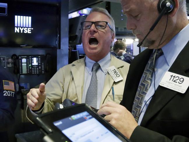 Trader Dermott Clancy, left, works on the floor of the New York Stock Exchange, Wednesday, Sept. 9, 2015. U.S. stocks are opening solidly higher as investors take their cue from big gains in Asia and Europe. (AP Photo/Richard Drew)