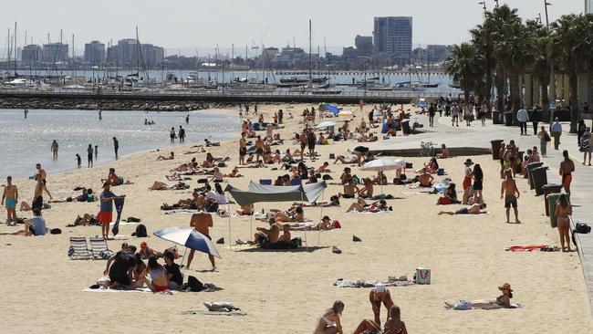 People enjoy the sunshine at St Kilda Beach this month. Picture: Daniel Pockett, NCA NewsWire