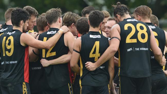 Goodwood Saints' coach Trent Mills in the huddle. Photo Naomi Jellicoe